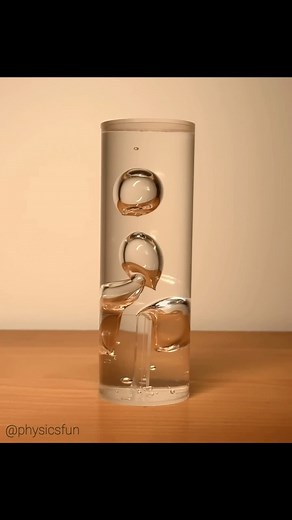 Bubbles in Viscous Fluid: an unusual vintage kinetic art piece I recently discovered- partitions in one end of the cylinder creates four bubbles in a viscous fluid that can then rise and interact. Peculiar motion results from both orientations, especially in how the bubbles merge. Another example of the surprising physics to be found in fluid motion. ➡️ Follow the link in my profile for info on how to obtain many of the amazing items featured here on @physicsfun #fluiddynamics #viscosity #viscou