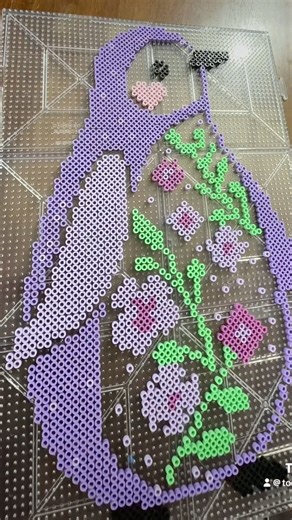 Purple floral penguin Perler bead art #perlerbeadart #penguin #penguinart #pixelart #beadartist