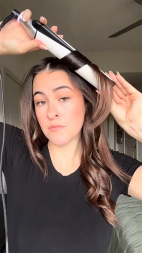 on text: how to curl your hair with a flat iron. Recipe for the perfect flat iron curl 🧑‍🍳: 1. Prep your hair with Curly Ever After – Curl Hold Spray for up to 24-hour curl hold. 2. Glide once, then wrap the hair twice around your ghd Chronos. 3. For soft waves, let the curls cool before brushing them out with The Comb Out Detangling Comb. | ghd