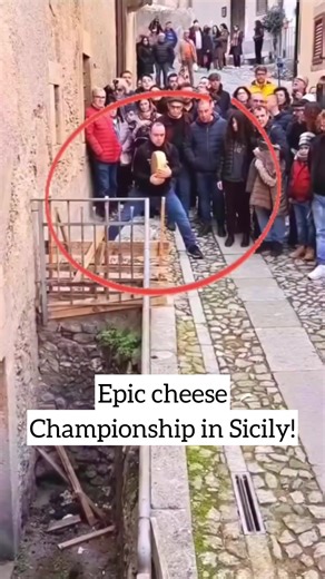 A huge wheel of aged cheese flying through the streets of Sicily 🇮🇹🧀 Every year this tiny town turns into a full-blown cheese battleground, rolling wheels to the finish line in one of Italy’s wildest traditions. Huge thanks to @lasiciliadifra for capturing it 🔥 #fyp #foryou #cheese #italy #foodporn
