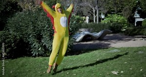A girl dressed as a chicken. Funny video of a woman in a chicken costume. Chicken with egg. The girl and the chicken egg. Stock Video