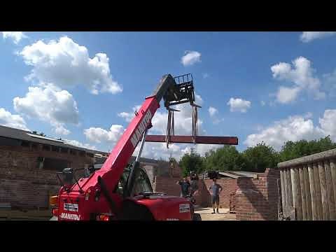 using a forklift to lift heavy beams of oak and steel