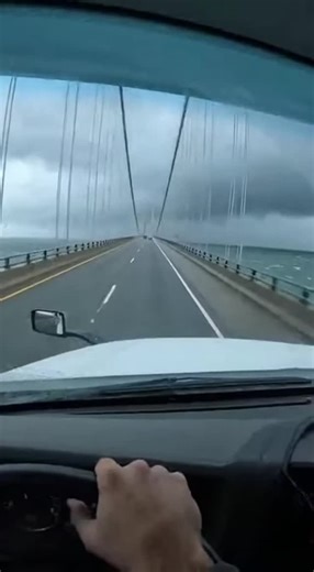 Videochika89 on Instagram: "Chesapeake Bay Bridge with 55mph crosswinds. Truck was rocking so bad I could feel the wheels lifting. Then that massive gust at 0:06 just SHOVED me left into the guardrail. Metal grinding, cargo shifting, pure terror. Made it across but my hands didn't stop shaking for an hour. Ever hit a rail from wind? 👇 #chesapeakebaybridge #boxtruck #highwinds #guardrailcrash #dashcam #scary #trucking #midnightmiles #windadvisory #maryland #closecall #blownover"