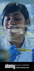 Scientist examining sample in laboratory with DNA strand animation overlay. Biotechnology, research, genetics, molecular, innovation, analysis Stock Video Footage - Alamy