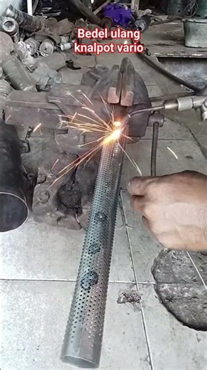 Repacking the Vario exhaust to make it quiet/smoother."