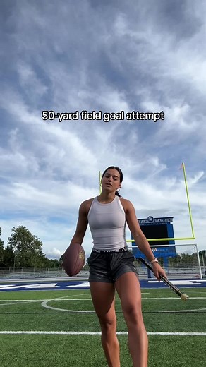 Attempting 50-Yard Field Goal Challenge in Soccer Gear