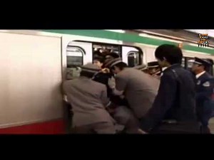 Japan Train Station Employees Pushing People Inside - Amazing How helpful they are