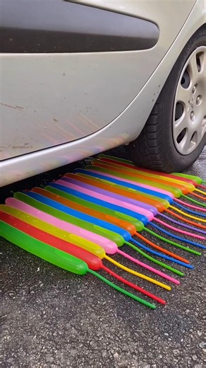 Crushing water-filled balloons with a car tire #asmr #satisfying #press