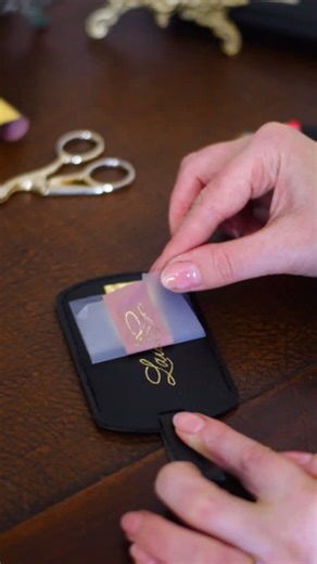 Uliana | UK Calligraphy, Engraving & Hot foiling on Instagram: "✨Heat foiling - also known as hot foiling is a unique way to combine artistic calligraphy with metallic shine to beautifully personalise leather or vegan leather items at your live on-site event. ✨Using a small, portable heat tool, the foil transfer is permanent. Guests will be captivated by the “foil reveal,” watching as the foil is slowly lifted to uncover the lettering below. ✨This technique is popular for both retail, private an