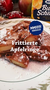 Nimm dich in acht vor dieser süßen Versuchung: frittierte Apfelringe mit Zimt-Zucker! 🍎✨ 😋 Die perfekte Mischung aus knusprig und saftig, mit einer Prise Zimt verfeinert – wer kann da widerstehen? 🍏 Zutaten: 300 g MEGGLE Butterschmalz (zum Frittieren) 2 große Äpfel (z.B. Boskop oder Elstar) 100 g Mehl 1 Ei 100 ml Milch 1 EL Zucker 1 TL Zimt Zimtzuckergemisch zum Bestäuben Zubereitung: - Äpfel schälen, das Kerngehäuse ausstechen und die Äpfel in etwa 1 cm dicke Ringe schneiden. - Mehl, Ei und 