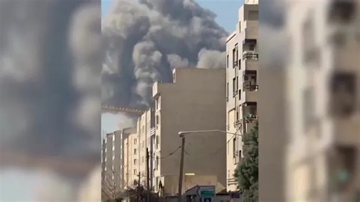 Smoke rises from Iran's Azadi Stadium after strike