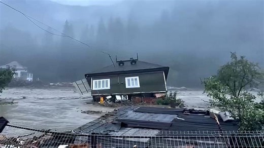 Flooding washes away homes in Romania