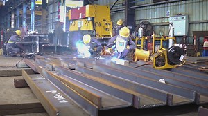 Premium stock video - Welders working at metal fabrication making structural channel beam