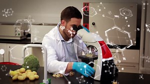 Premium stock video - Animation of molecular structure moving over caucasian male scientist using microscope