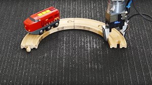 Watch a Robotic Arm Keep a Toy Train on an Infinite Loop