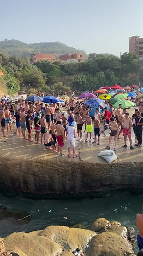 Enjoying Leisure Activities on a Crowded Beach