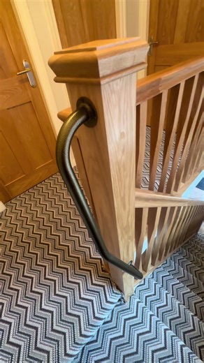Gorgeous Oak Stair Bainster Renovation. Using contemporary oak twisted spindles & assisted grab rails designed to match hallway ironmongery. #StaircaseRenovation #ReplaceBanisters #oakbanister