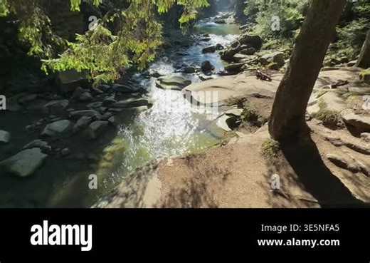 Mountain river with high rocky banks in sunny day backlit Stock Video Footage - Alamy