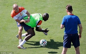 Arjen Robben clashes with Netherlands teammate Bruno Martins Indi during training