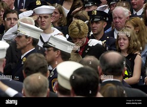 KRT US NEWS STORY SLUGGED: ATTACKS-FUNERAL KRT PHOTOGRAPH BY KAREN SCHIELY/AKRON BEACON JOURNAL (September 24) BROOKLYN, NY -- Kevin Stackpole, 18, in U.S. Navy uniform, salutes his father's casket after the funeral mass for his father, Captain Timothy Stackpole of the New York City Fire Dept., on Monday, September 24, 2001. His mother Tara Stackpole wipes away tears, center, and his sister Kaitlyn, 15, is on the right. (Photo by AK) NC KD BL 2001 (Horiz) (mvw Stock Photo - Alamy