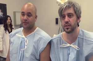 Two grown men go through a labor simulation.