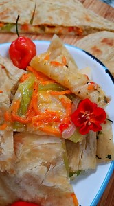 This recipe is really close to my heart ❤️ This is my Nana's "Long Time" Pepper Roti 🤤 I have never seen anyone make pepper roti the way my Nana and his brothers did back in the days. After cooking massive buss-up shut / paratha rotis for weddings and prayers, the last loya was always made into either a pepper roti or sugar roti for all the cooks to enjoy. Just a whiff of the roti took me back to being a little girl again 🥹 Will share the full recipe to my YouTube channel soon! #PepperRoti #Na