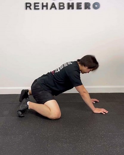 Quadruped Rock Back - hip adductor stretch exercise for groin and inner thigh flexibility