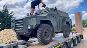 Inspecting a Humber Pig, evaluating a Cold War armored vehicle for the museum collection