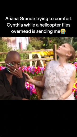 Ariana Grande trying to comfort Cynthia Erivo while a helicopter flies overhead is sending me😭