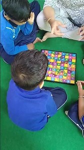 Learning maths with Snake and Ladders game by Kids at Prema's School Jodhpur