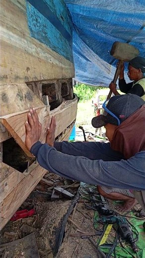 The very tense moments of repairing a fishing boat