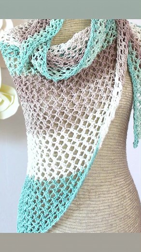 NEW Offshore Mesh Shawl Knitting Pattern creates a beautifully light and airy triangle-shaped design knitted with self-striping colored yarn, perfect for staying cool in warm summer weather. | Studio Knit