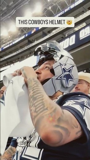 Dallas cowboys fan wearing a full iron man cowboys mask