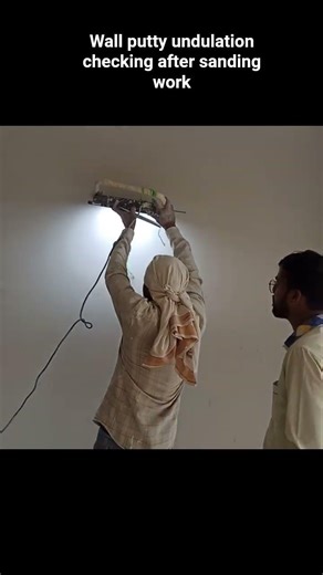Wall putty undulation checking after sanding work #shorts #shortsvideo #construction #putty