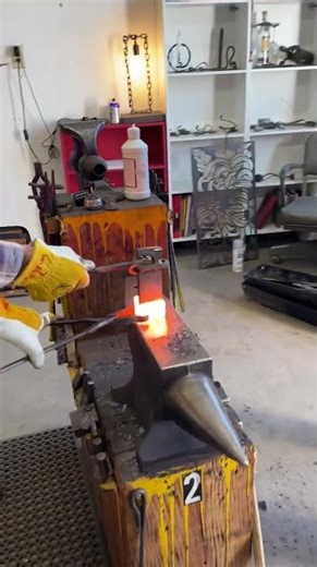 Team striking to cut Damascus steel with a sledge hammer #blacksmith #blacksmithing #forge #forging