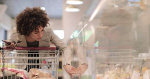 African American shopper at deli counter in a grocery store