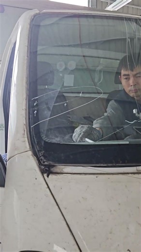 Removing the windshield of a KIA K250 truck.