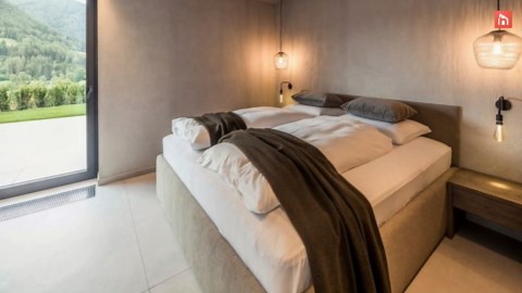 A luxury modern chalet has a pool for each of its suites