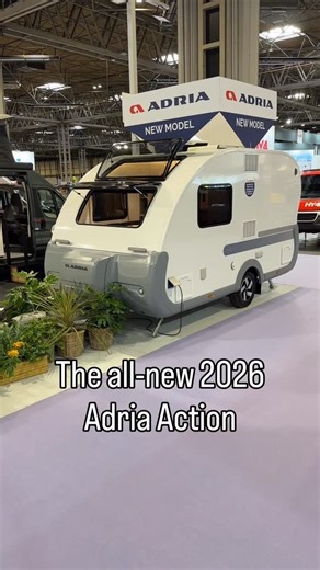 This is the all-new 2026 Adria Action 391LH. It’s slightly longer than the old model, with several redesigned features. The new plastic body kit is much tougher than the old one, it features a new A-frame mounted gas locker, and there’s an integrated awning light that’s also dimmable! Inside, the interior has been improved with a new larger washroom with a clever folding shower screen, there’s a large Dometic fridge/freezer, a built-in coffee machine, concealed extra worktop, and the bed at the 