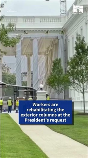 Tarps with printed columns conceal front of White House during renovations