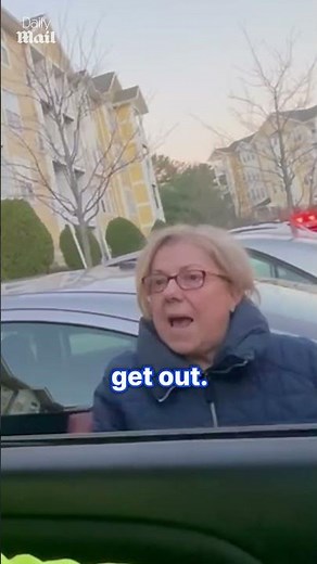 Angry woman demands driver move from parking spot