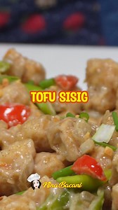 How to cook sizzling crispy tofu sisig. Easy tokwa recipe. Ingredients: 8 pcs Tofu 2 cups All purpose flour 1 to 2 tbsp Seasoning powder Black Pepper Oil for frying Sauteed Veggies 1/8 cup Margarine 5 cloves garlic Red & Green Bell Peppers Green Chillies White Onion Black Pepper 1/2 to 1 tbsp Seasoning powder Special Sauce 3/4 cup Mayonnaise 1/8 cup Liquid seasoning 1 tsp sugar black Pepper Garnish: Egg (optional) Green and red chillies Green Onions #tofusisig #tofu #SizzlingTofu | Nina Bacani