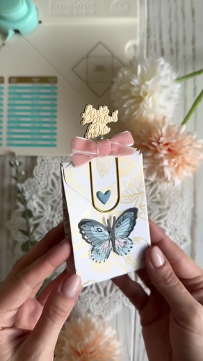 Got a wedding coming up? Create a little wedding favor with your envelope punch board! Read below for a supply list and instruction from Julia Sachs @Fraeuleinfotofee, then shop this crafter's must-have tool at your local @JOANN Stores. SUPPLIES & TOOLS: Envelope punch board: https://www.joann.com/envelope-punch-board-6.75inx10.5in/12840203.html Woodland Grove collection by Maggie Holmes for @americancrafts --pearlescent paper 12x12 inch --layered stickers --charm pins DIRECTIONS: 1)\tCut a piec