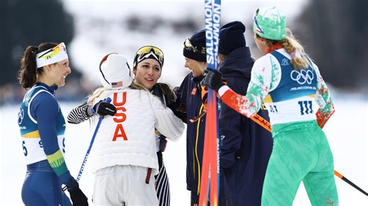 Skiers celebrate Regina Martinez Lorenzo at 10km finish line