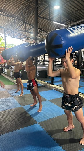 Neck Strengthening for Muay Thai Using a Heavy Bag Muay Thai fighters strengthen their necks to absorb strikes—especially from clinch, elbows, and knees—enhance clinch control, and reduce the risk of injuries such as whiplash or concussions. The heavy bag provides resistance, mimics the weight and pressure of an opponent, and enables dynamic, sport-specific neck training that reflects real clinch scenarios. Stand upright or in a light Muay Thai stance.Press your forehead into the heavy bag while