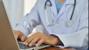 Doctor using computer Document Management System (DMS), online documentation database process automation to efficiently manage files