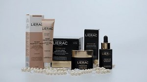 Tbilisi, Georgia - December 30 2023: Close up shot of Lierac multi-purpose cosmetic set, face,body and hair, Set of different bottles of cream or serum on white background
