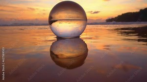 amazing view of colorful sky of sunset inside crystal ball..colorful sky in the reflection of the sea water that flooded the crystal ball..The reflection of the bright sky on the water surface..