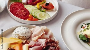 Luxury hotel and five star room service, various food platters, bread and coffee as in-room breakfast for travel and hospitality. High quality 4k footage