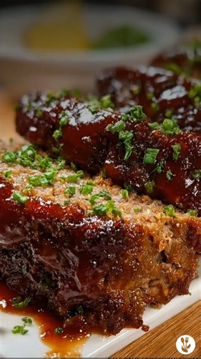 This BBQ-Glazed Meatloaf is a hearty, crowd-pleasing dinner packed with bold flavor. Juicy ground beef is mixed with onions, Parmesan, garlic, and Worcestershire sauce, then baked to perfection and brushed with a rich layer of Sweet Baby Ray’s barbecue sauce for a sticky, caramelized finish. Ingredients: • 2 pounds ground beef • ½ cup panko bread crumbs • ½ cup white onion, diced • 2 large eggs • ½ cup Sweet Baby Ray’s Original Barbecue Sauce • ½ cup grated Parmesan cheese • 1 tablespoon garlic,